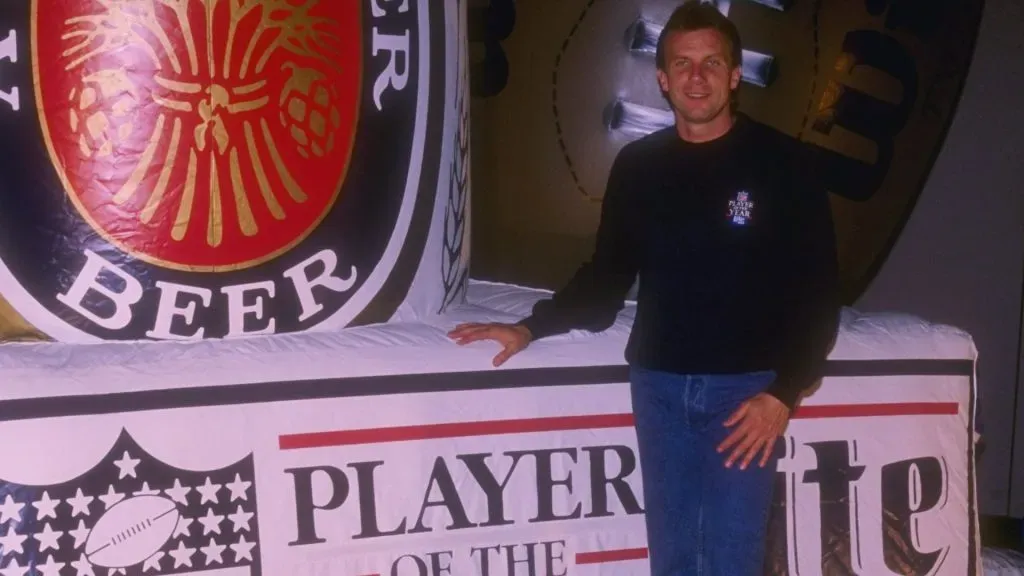 Joe Montana of the San Francisco 49ers celebrates after being named the Miller Lite Man of the Year before Super Bowl XXIV.