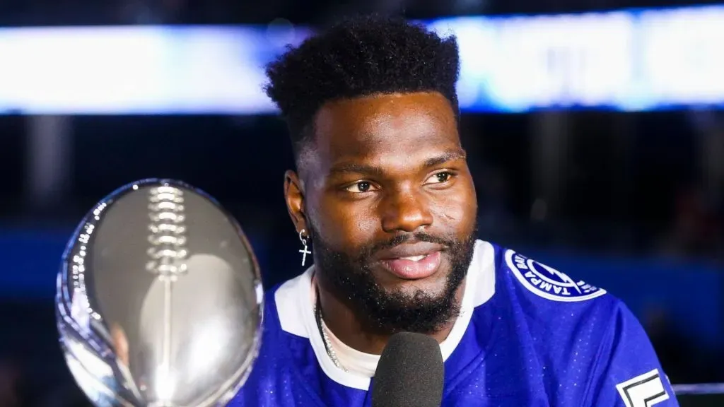 Shaq Barrett, who brought along the Lombardi Trophy, talks with Paul Kennedy, Fox Sports broadcaster.