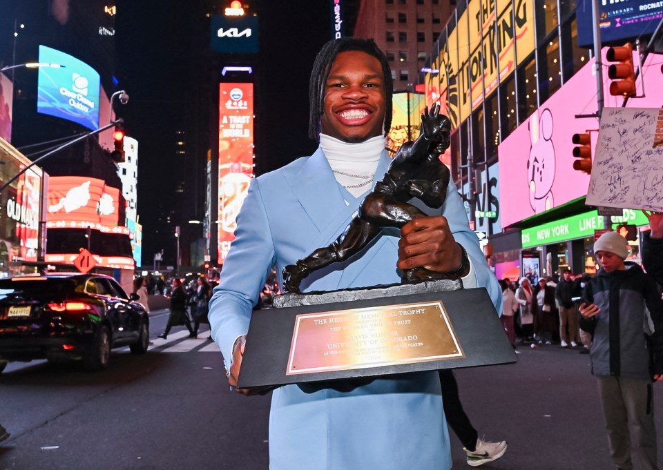 Hunter shows off his trophy in Times Square, New York City