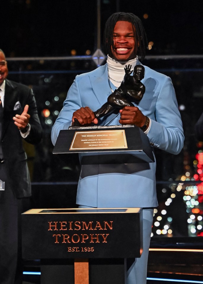 Travis Hunter poses with his Heisman Trophy award