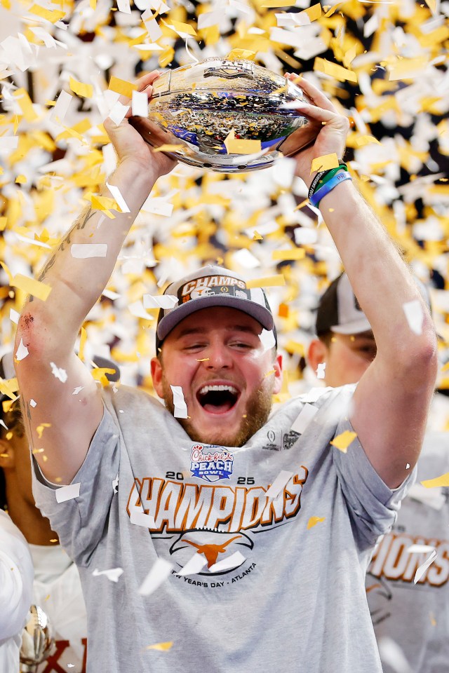 Ewers holds the trophy after beating Arizona State 39-31 in double-overtime