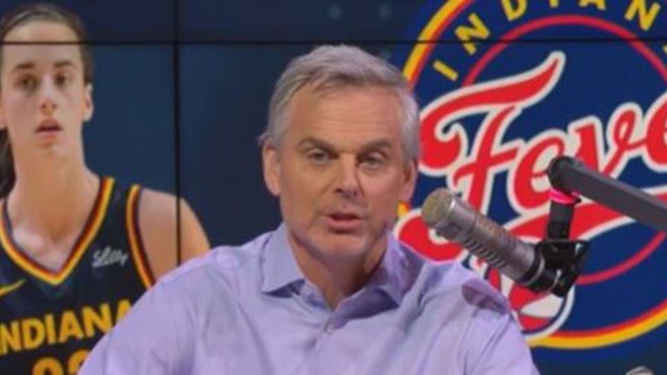 Colin Cowherd speaking into a microphone