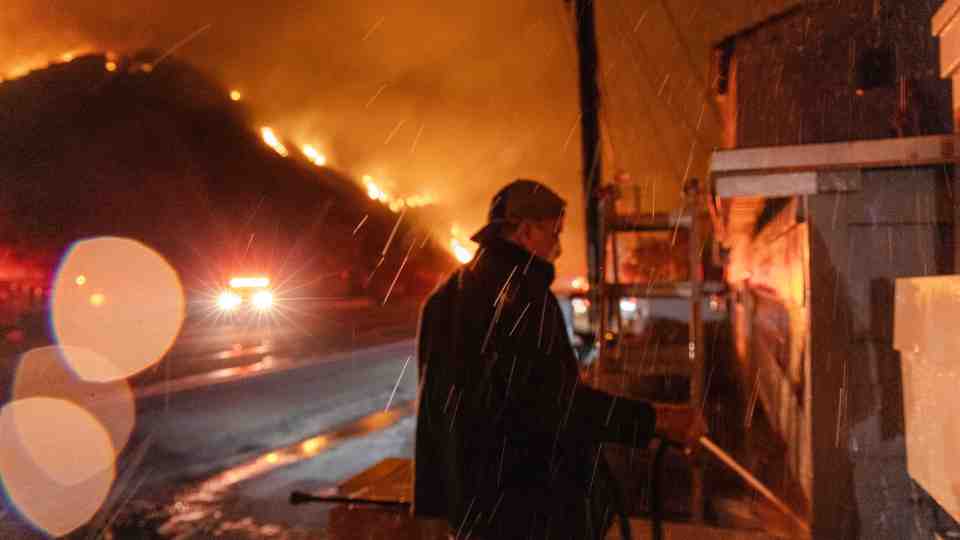 Two have been killed as the fire savages through multiple suburbs of Los Angeles