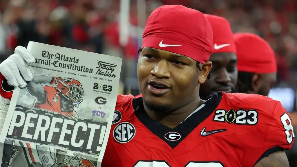 Jalen Carter #88 of the Georgia Bulldogs celebrates with a newspaper reading “Perfect!” after defeating the TCU Horned Frogs in the College Football Playoff National Championship game at SoFi Stadium on January 09, 2023 in Inglewood, California.