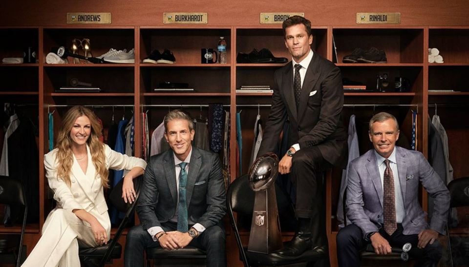 Four FOX NFL commentators sitting in a locker room.