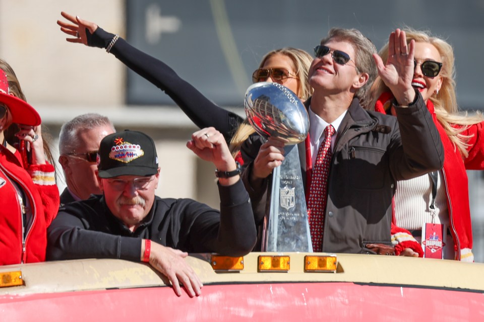 Clark Hunt, owner of the Kansas City Chiefs, holding the Vince Lombardi Trophy during a victory parade.