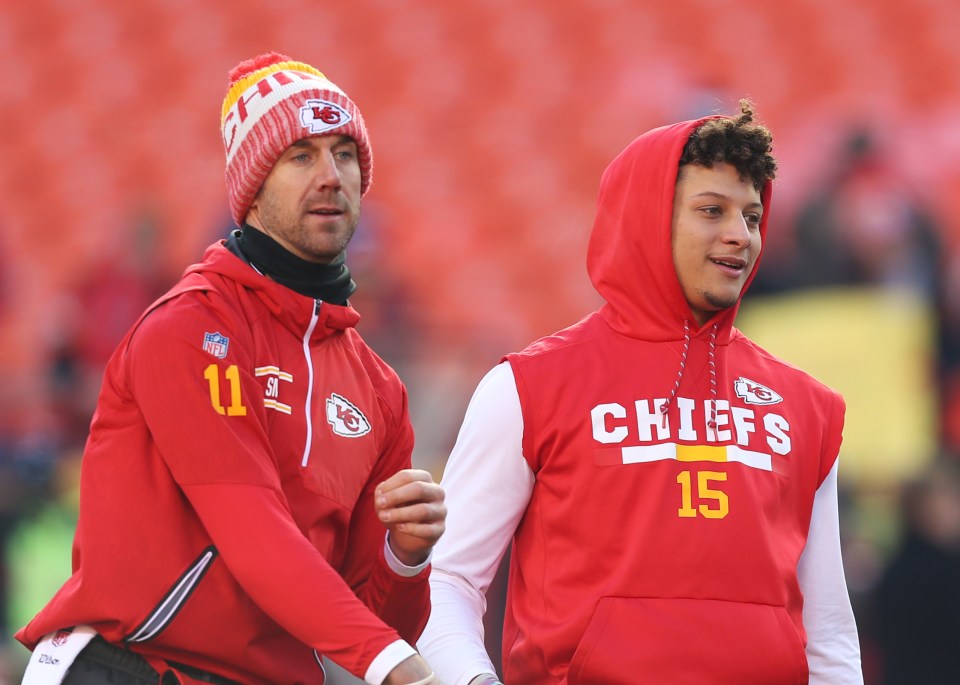 Kansas City Chiefs quarterbacks Alex Smith (11) and Patrick Mahomes (15) warming up.