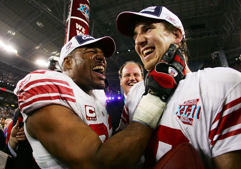 Eli Manning and Michael Strahan celebrating their Super Bowl XLII victory.