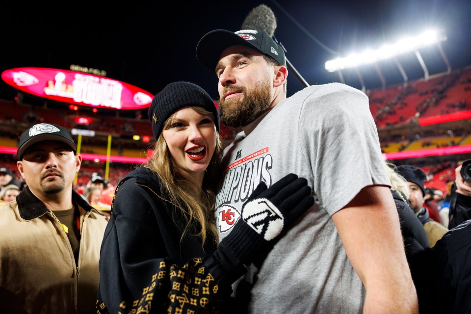 Travis Kelce and Taylor Swift celebrating after a football game.